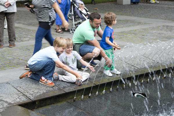 Boys playing in the fountain